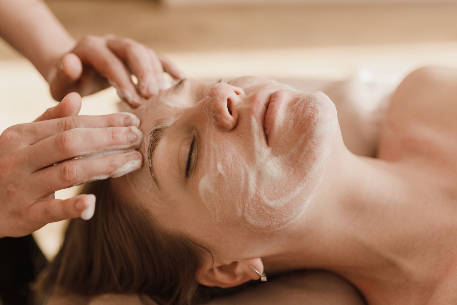 Editorial image of a facial massage treatment.